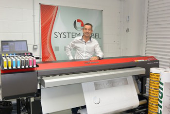 Alan Beirne stands proudly behind his SOLJET PRO4 XF-640 printer